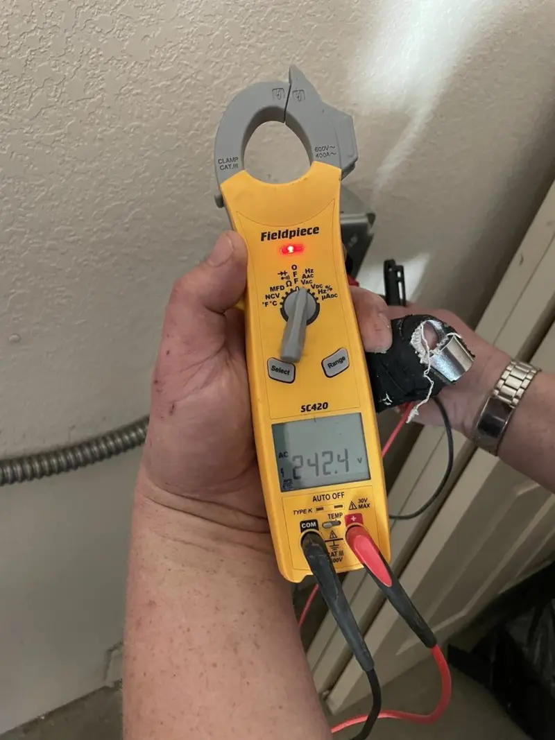 Voltage testing with clamp meter during Electrical Installation Services in Lambertville
